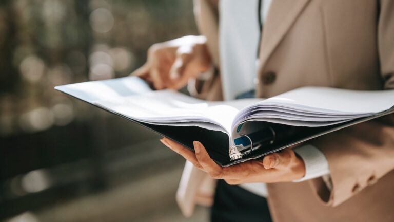 Lawyer with binder with FCRA requirements for employers