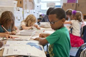 Classroom with young students depicting jobs that require a criminal record check