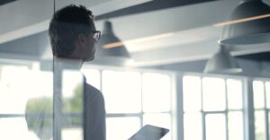HR leader presenting to conference room about why background checks are important