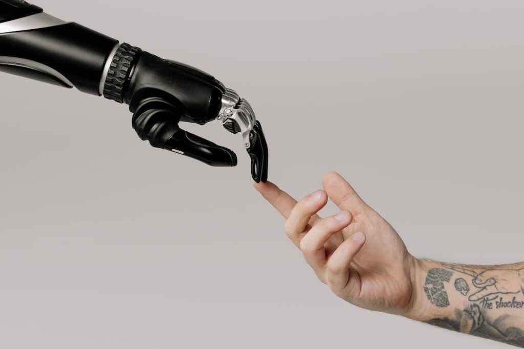 Robot hand and human hand touching to symbolize background check industry trends responsible AI