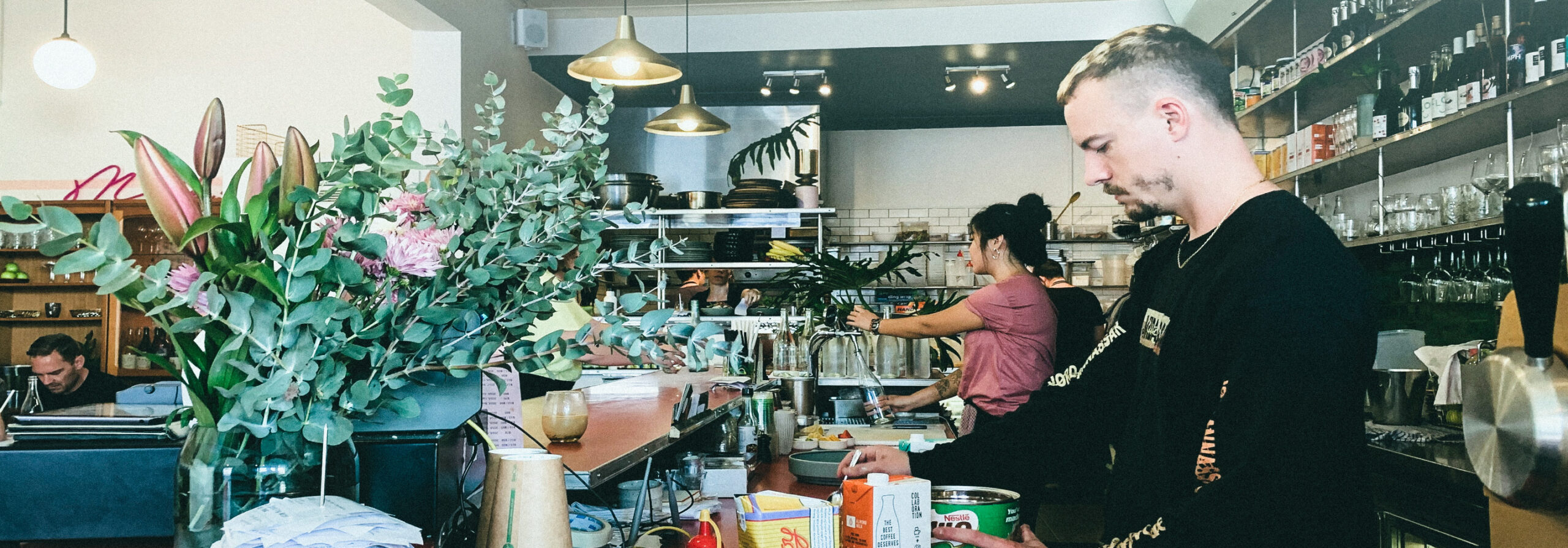 Employee working at retail counter in safe environment with retail background checks