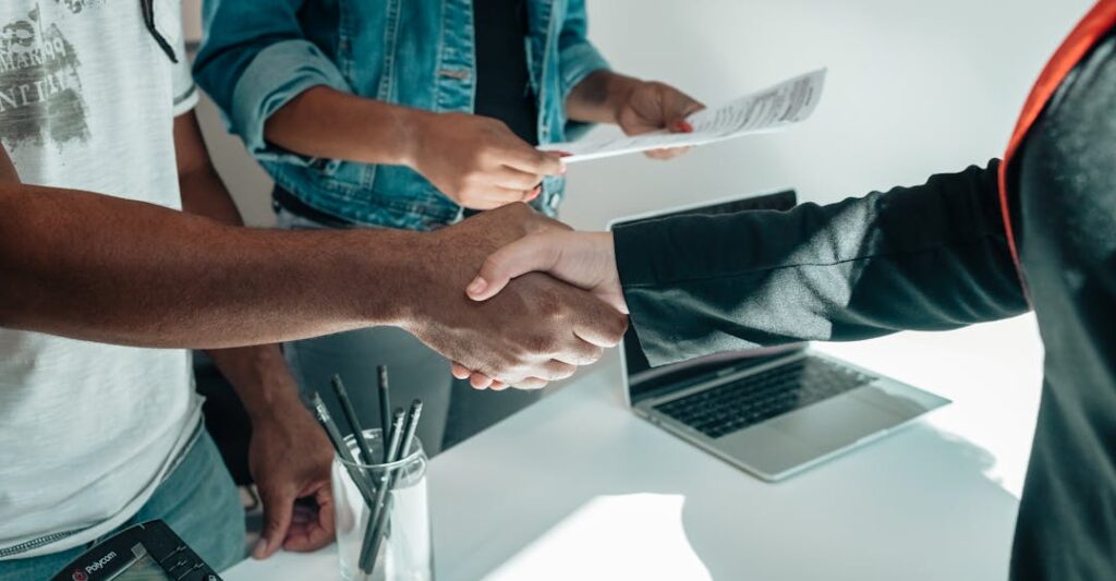 Background screening for Canadian property management solidifies deal with handshake for renters