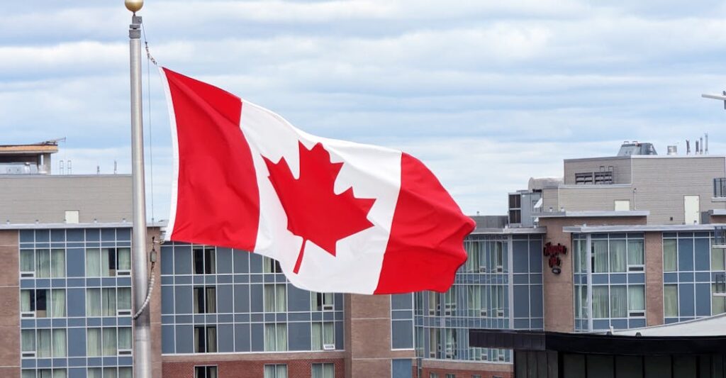 Canadian flag on flagpole in Halifax, NS representing criminal record checks for government employment in Canada