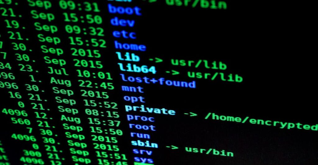Computer codes on laptop representing blockchain and cybersecurity through verifiable credentials