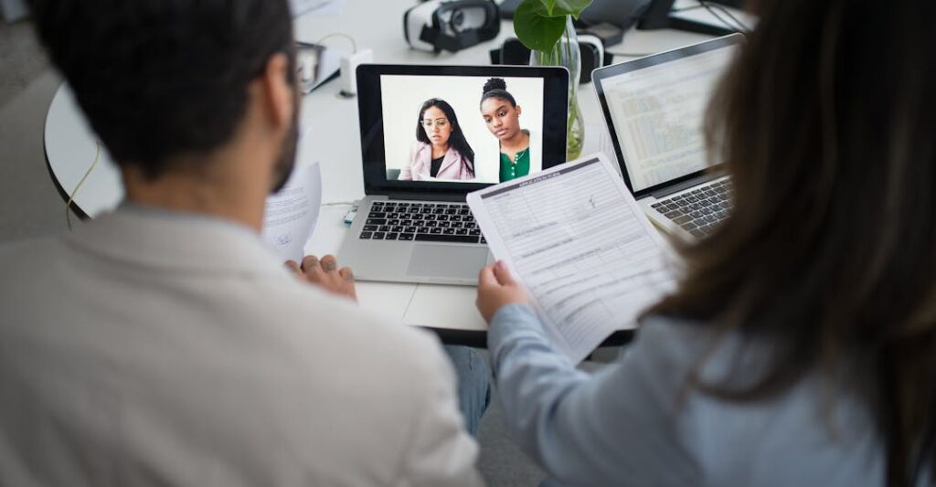 Remote job interview in progress on laptop before background check process