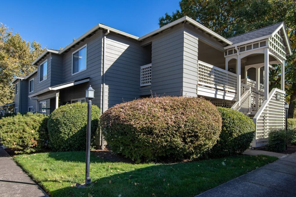 A house with a porch and a lawn in Canadian rental property with tenant screening services