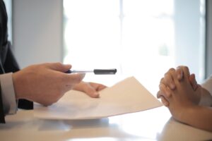 New employee receiving contract to sign representing FCRA background check requirements