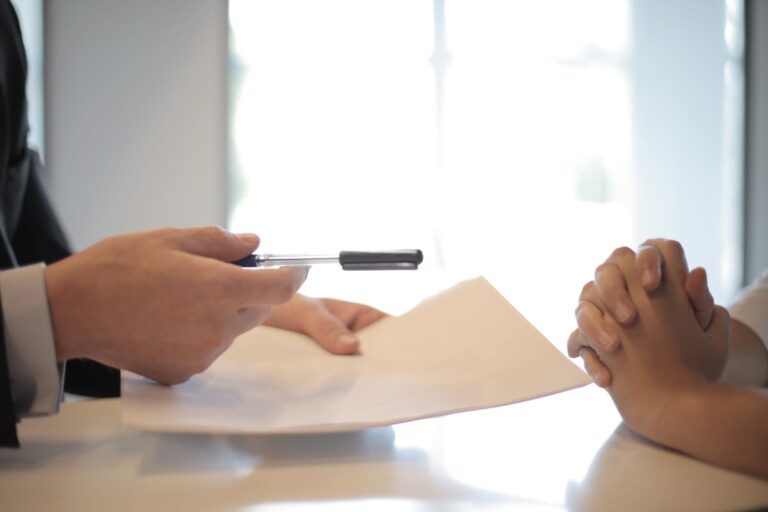 New employee receiving contract to sign representing FCRA background check requirements