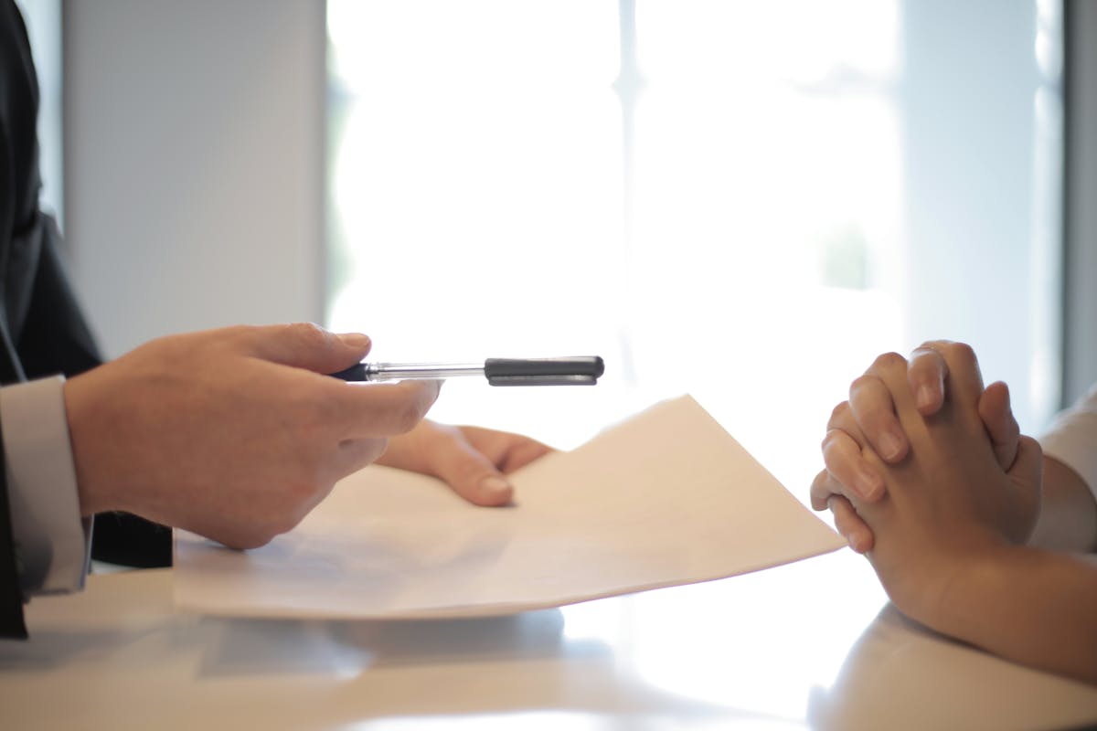 New employee receiving contract to sign representing FCRA background check requirements